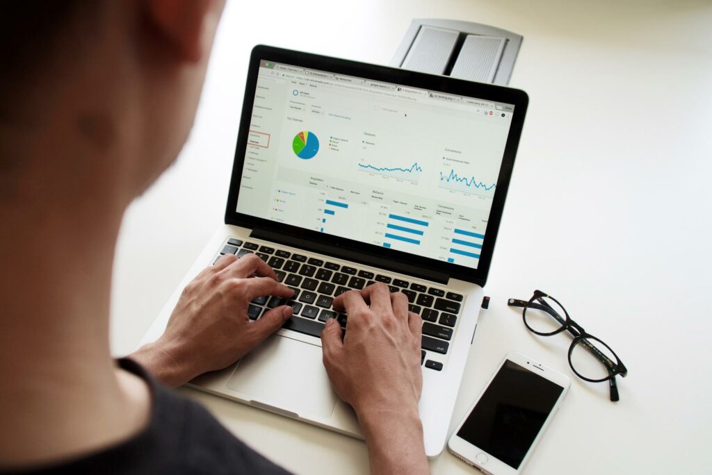 Designer checking Google Analytics on laptop